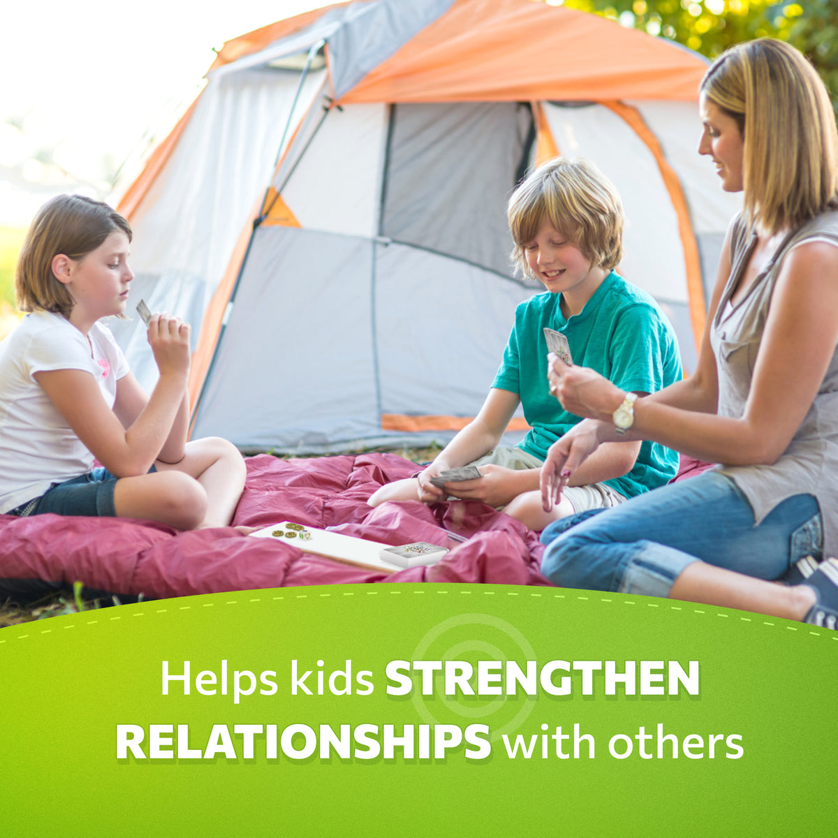 Children and a parent playing Mindfulworld while camping.